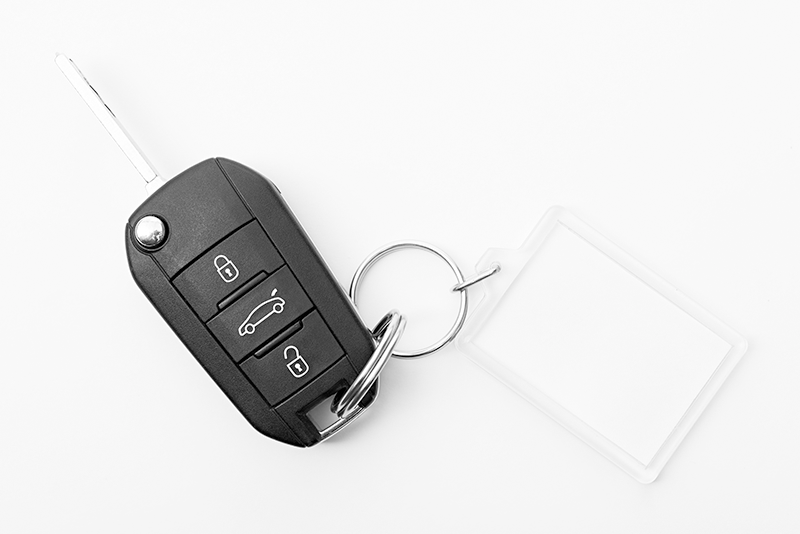 Black car key with remote and blank key tag